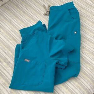 Women’s Figs scrub set, Size Small in a darker teal color.
